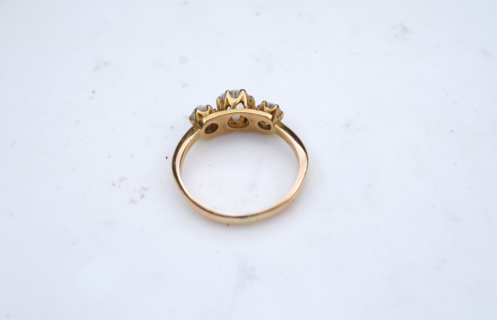 A three-stone diamond ring, early 20th century